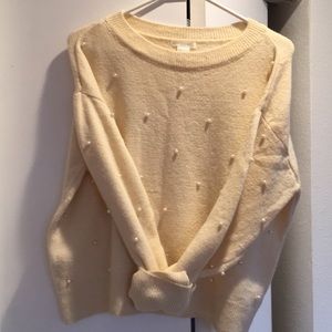 Cream sweater.